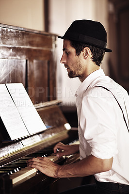 Buy stock photo Piano, reading or man playing music, performance or entertainment with talent, art or freedom. Learning solo, pianist or creative musician with keys on instrument or organ with paper or notes