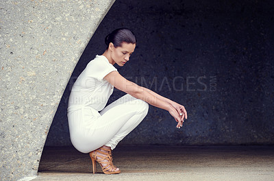 Buy stock photo Full length shot of a beautiful fashion model posing in an empty urban setting