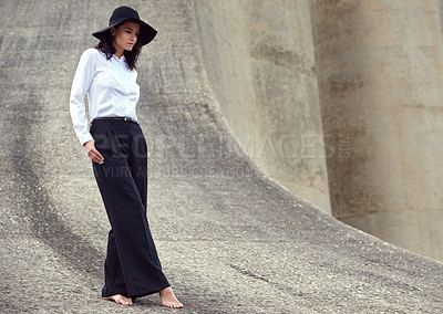 Buy stock photo Full length shot of a beautiful fashion model posing in an empty urban setting