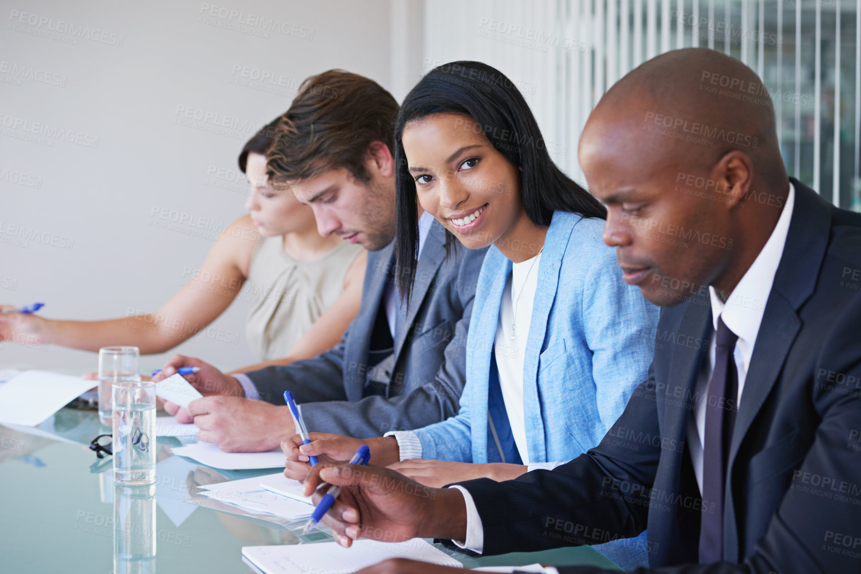 Buy stock photo Portrait, businesswoman and meeting in office for strategy, teamwork and planning for project. Diversity, collaboration and brainstorming for company with pride and documents in conference room 