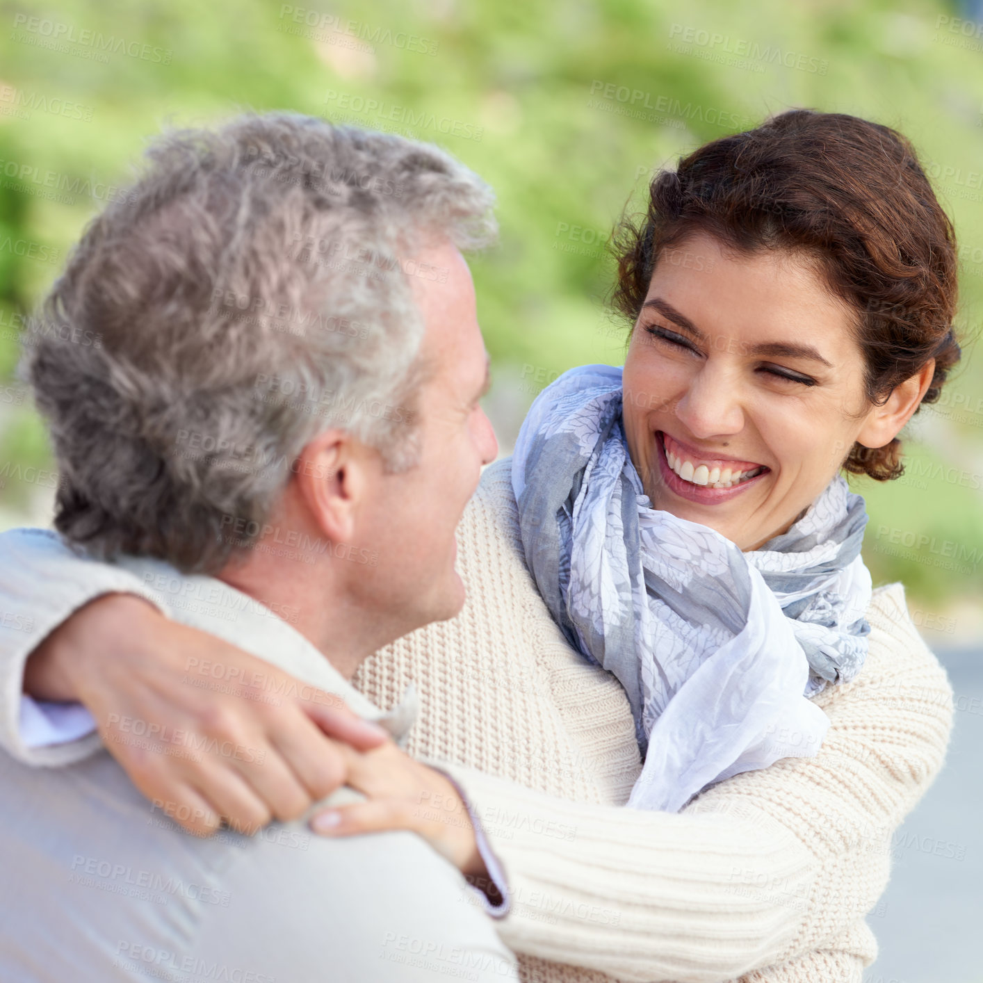 Buy stock photo Couple, face and laughing outdoor with hug for romance, love and relationship in nature with relaxing. Mature, man and woman or embrace with happy, playful and joy for bonding, honeymoon and support 