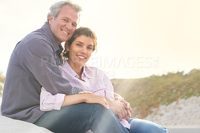 Buy stock photo Couple, face and smile in nature with hug for romance, love and relationship on beach with relaxing. Mature, man and woman or embrace with happy, peace and trust for bonding, honeymoon and support 