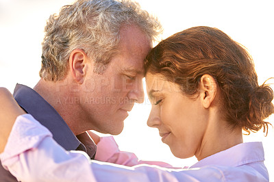 Buy stock photo Mature, couple and forehead together with love, support and care in marriage or partnership. Outdoor, man and woman with gratitude, empathy or embrace at sunset on holiday or vacation with happiness