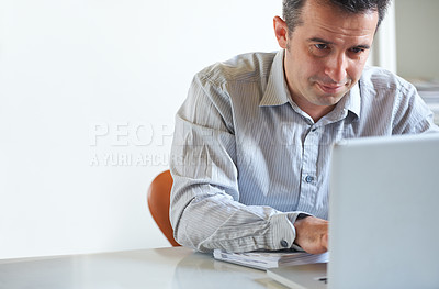 Buy stock photo Cropped shot of a stressed out businessman using a laptop