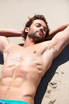 Buy stock photo Man, beach and relaxing on sand for travel, vacation or holiday in summer sunshine. Person, healthy and seaside for island trip, getaway or weekend break for peace, mindfulness and adventure