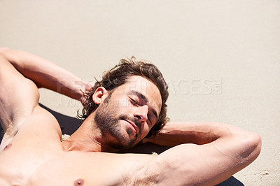 Buy stock photo Man, shirtless and relax on sand beach for tan, outdoor recreation and vacation for summer trip and travel. Young person or male tourist and eyes closed for bliss or enjoyment in sun on holiday break