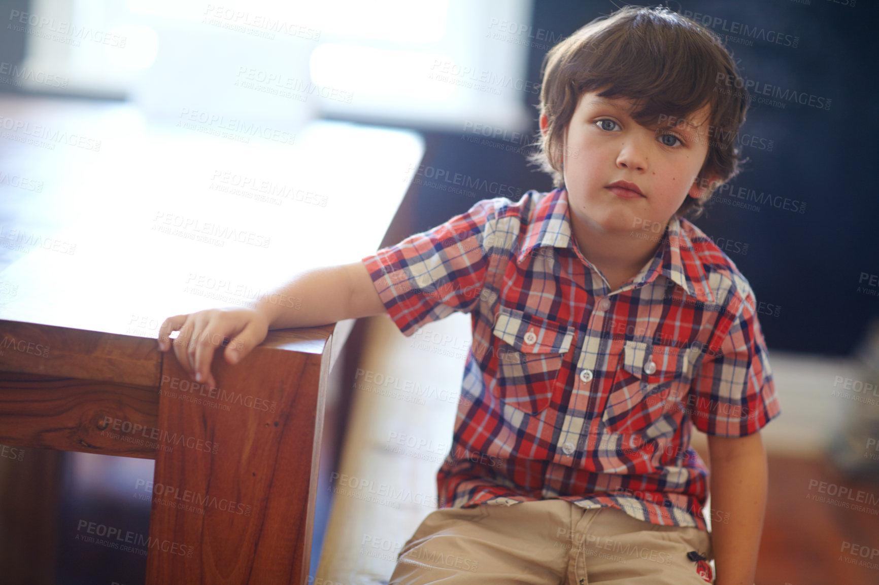 Buy stock photo Shot of a cute little boy looking at the camera