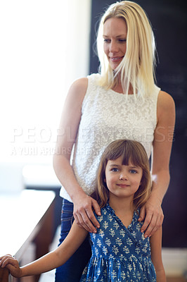 Buy stock photo Shot of a happy mother and daughter spending quality time together at home