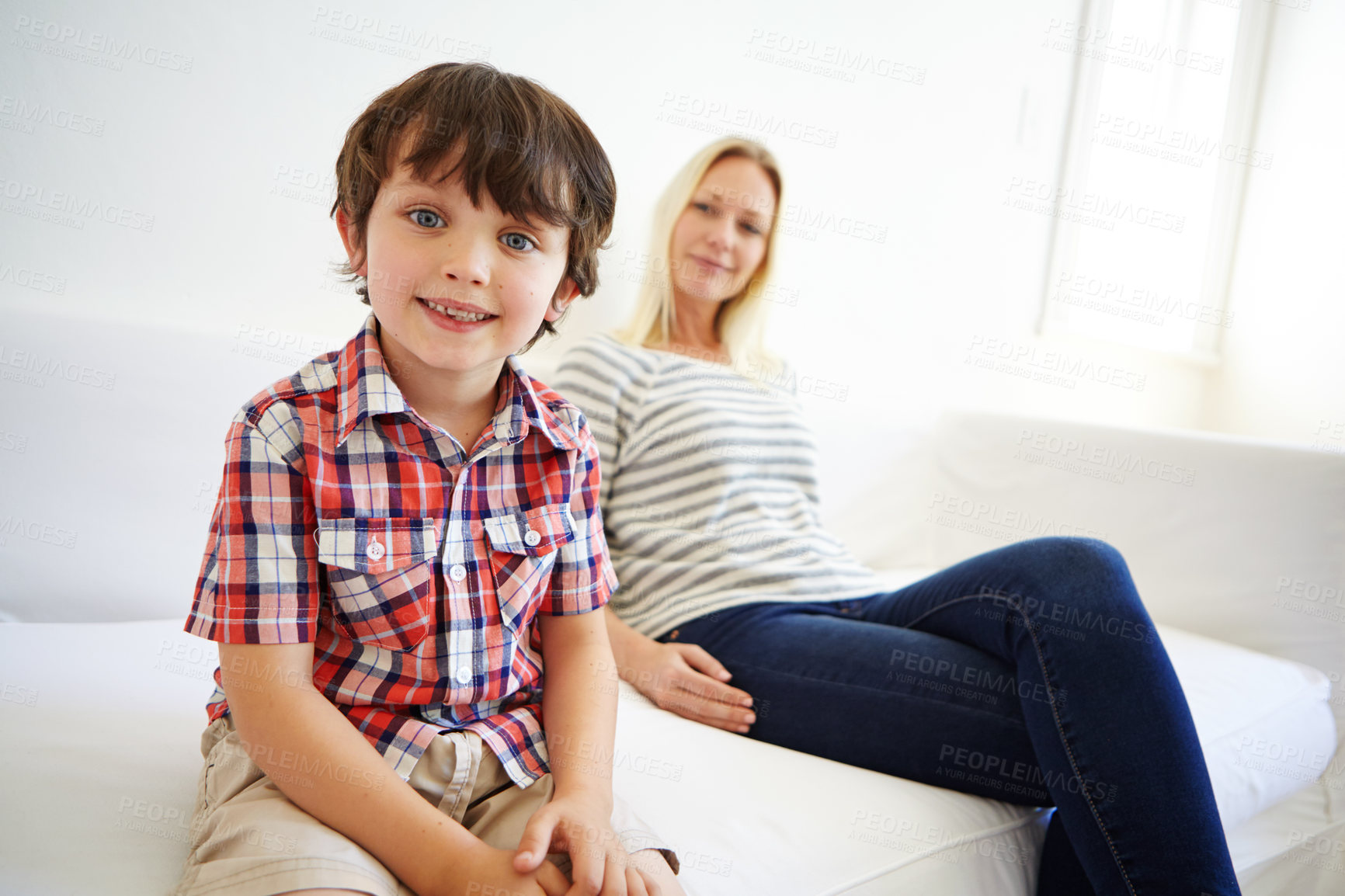 Buy stock photo Shot of a happy mother and son spending quality time together at home