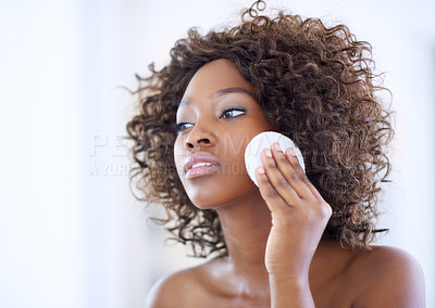 Buy stock photo Shot of a beautiful young woman during her daily beauty routine