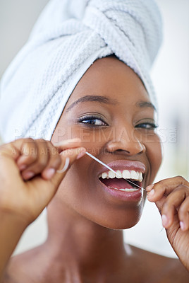 Buy stock photo Dental health, portrait and black woman with floss in bathroom for fresh breath in home. Happy, oral care and African person cleaning teeth with thread for cavity, plaque removal and wellness.