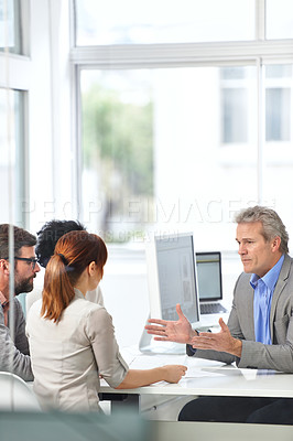 Buy stock photo Senior businessman, meeting and coaching with team in data analytics, finance or discussion at office. Man, CEO or executive talking to group of employees for financial growth or revenue at workplace