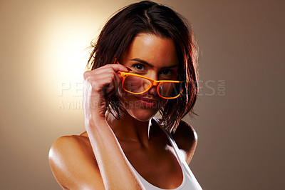Buy stock photo Portrait, fashion and woman with glasses in studio for vision isolated on a brown background mockup space. Face, eyewear and beauty of young model in spectacles for optometry or eye care in Germany