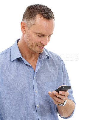 Buy stock photo Typing, phone and business man in studio isolated on a white background for social media. Technology, smartphone and mature male entrepreneur with mobile cellphone for networking or text messaging.