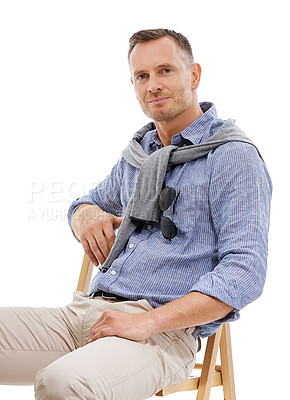 Buy stock photo Portrait, fashion and man with style sitting on a chair and confident person isolated in a studio white background. Trendy, gentleman and guy or model looking handsome, stylish and well dressed