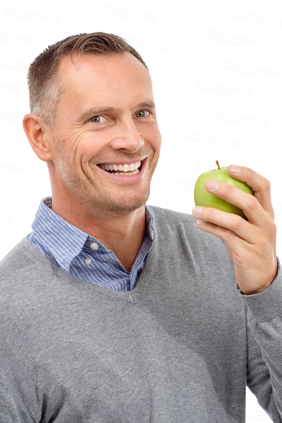 Buy stock photo Man, eating apple and studio portrait with fruit for health, diet and wellness isolated on a white background. Model person with nutrition vegan food for healthy lifestyle, motivation and happy smile