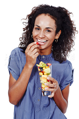 Buy stock photo Studio portrait of an attractive woman eating a fruit salad against a white background