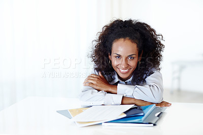 Buy stock photo Cropped portrait of a female designer with documents in front of her