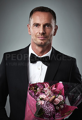 Buy stock photo Portrait of mature man, suit and bouquet of flowers, handsome and isolated on grey background. Luxury, romance and rich celebrity actor fashion with romantic sexy date for valentines day and love.
