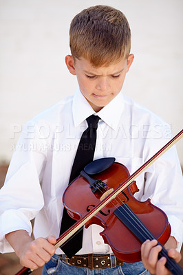 Buy stock photo Art, skills and child with violin for creative sound and playing audio with young musician in concert. Orchestra music, string instrument and violinist boy in performance in talent show for children