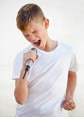 Buy stock photo Microphone, karaoke and creative talent of kid in studio isolated on a white background. Child on mic, singer and music, play and recording voice, sound or audio performance of musician on technology