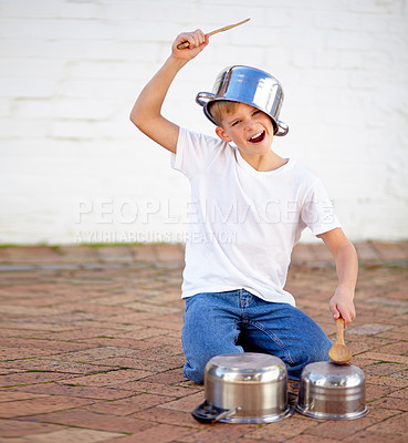 Buy stock photo Pots, drums and child with portrait, creative noise and playing audio with young musician. Music, sound and inspiration, happy boy with pans in performance and talent show for children in backyard.