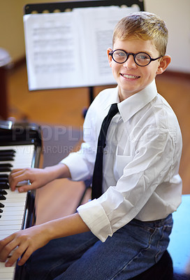 Buy stock photo Child, piano and music as pianist, keyboard and confident with learning, musician and enjoy. Talent, portrait and creativity with maestro, play and happy for musical, boy and practice concentration
