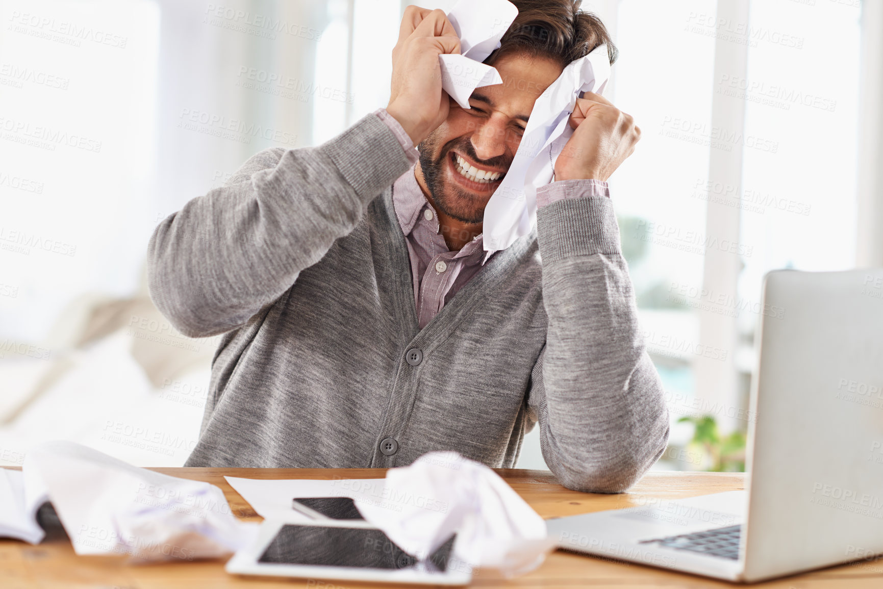 Buy stock photo Man, laptop and frustrated at work with paper on desk, overtime and stress to meet deadline. Startup, office and documents for research on information for business growth with notes and upset