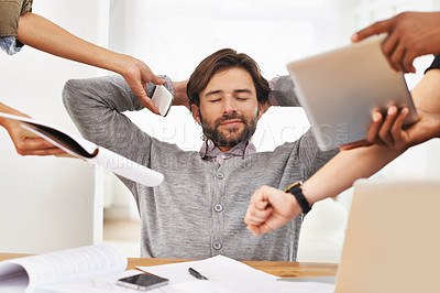 Buy stock photo A cropped shot of a handsome businessman with colleagues requesting various things from him