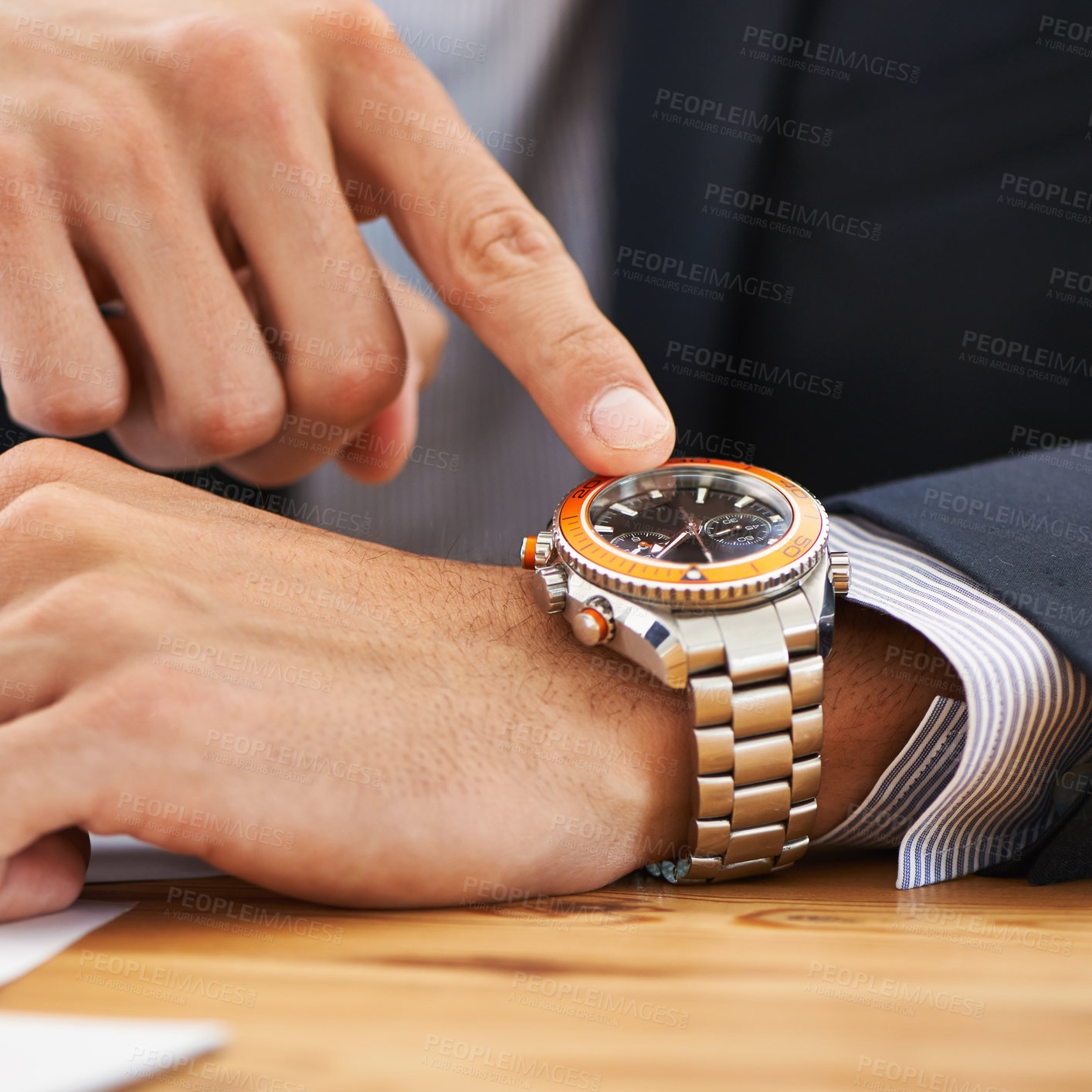 Buy stock photo Cropped shot of a businessman checking the time on his watch