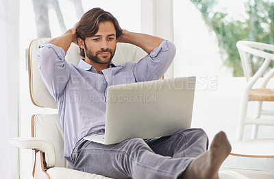 Buy stock photo Businessman, relax and couch with laptop online for remote work, living room and home office for freelance job. Male person, social media and browsing or research on computer, sofa and smile