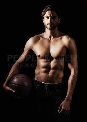 Buy stock photo Cropped image of a muscular young man holding a soccerball