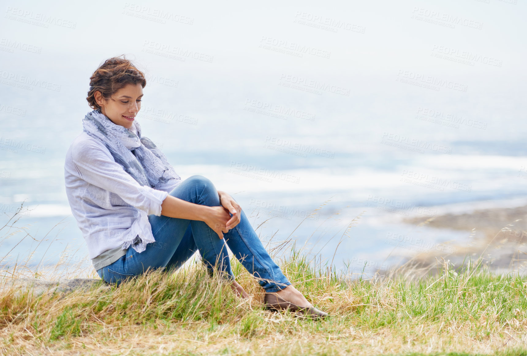Buy stock photo Woman, thinking and relax in nature at beach with happiness, gratitude and peace on holiday or vacation. Ocean, mock up and person on hill at the sea with ideas for future, travel and environment