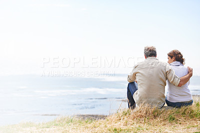 Buy stock photo Couple, hug and travel by the beach with love on holiday, vacation or marriage with mockup space. Summer, nature and man embrace woman with support, care and trust with landscape of sea and ocean