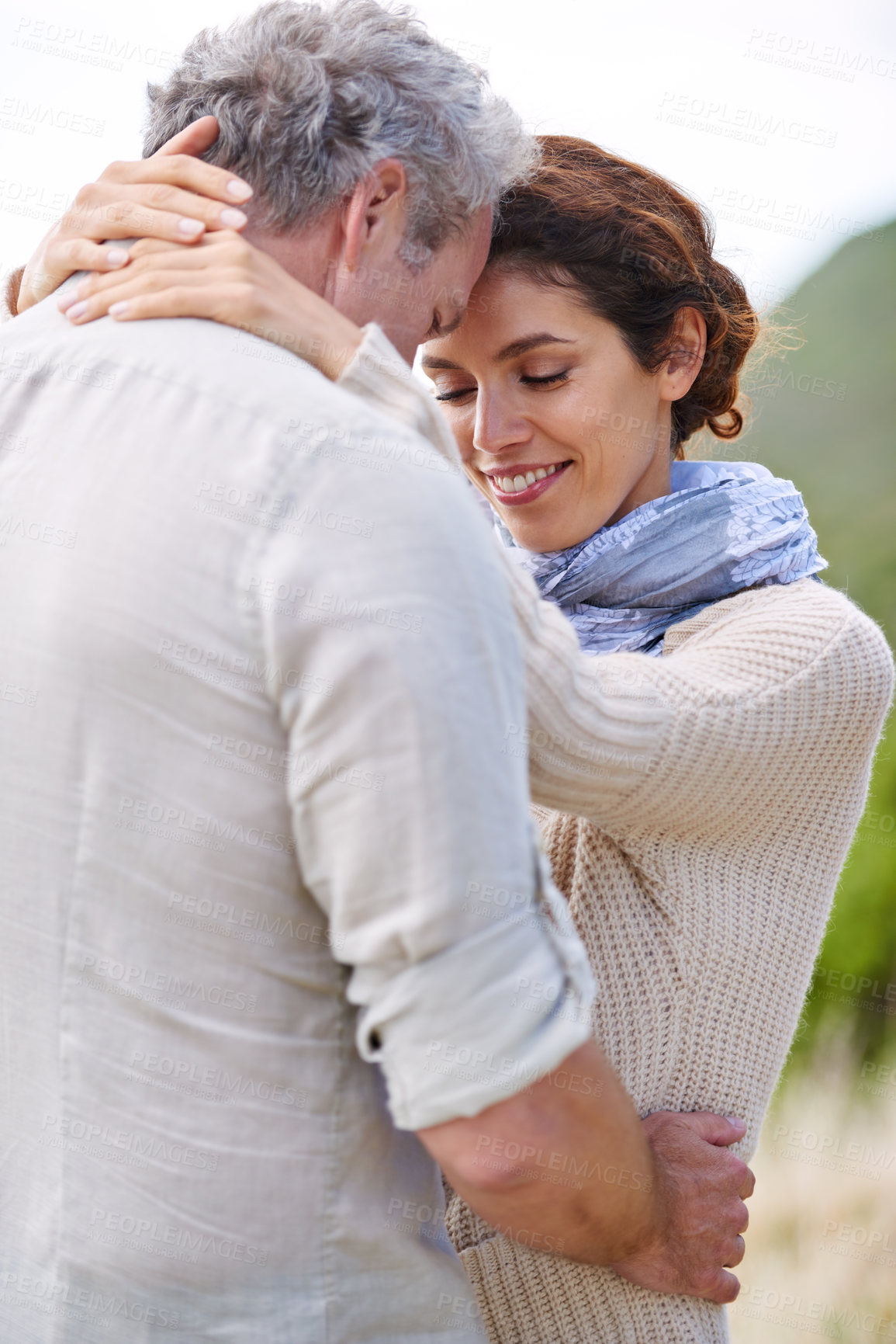 Buy stock photo Couple, face and smile in nature with hug for romance, love and relationship outdoor with date. Mature, man and woman or embrace with happy, marriage and joyful for bonding, honeymoon and support 