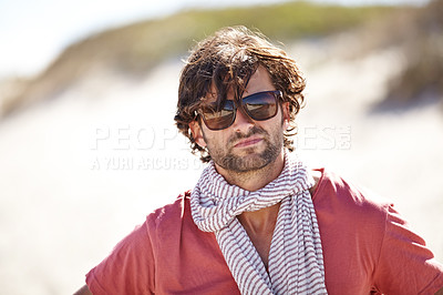 Buy stock photo Man, sunglasses and portrait in dessert for vacation and relaxing break in summer holiday. Handsome male tourist or traveler and serious with scarf for travel aesthetic, adventure or explore outdoor