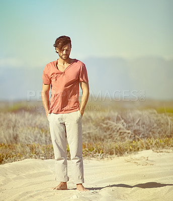 Buy stock photo Man, barefoot and alone deserted on outdoor sand for adventure, journey and solo holiday getaway. Person, walking and thinking in summer heat for travel, vacation or exploration of the wilderness