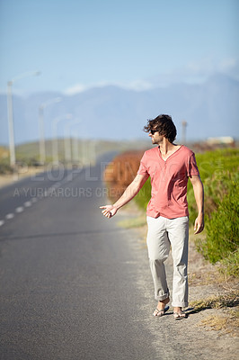 Buy stock photo Man, hitchhiking and hand sign for taxi on road trip or travel journey and adventure in summer. Tourist, person or explorer outdoor on highway hailing for cars, drivers and lift on vacation walking