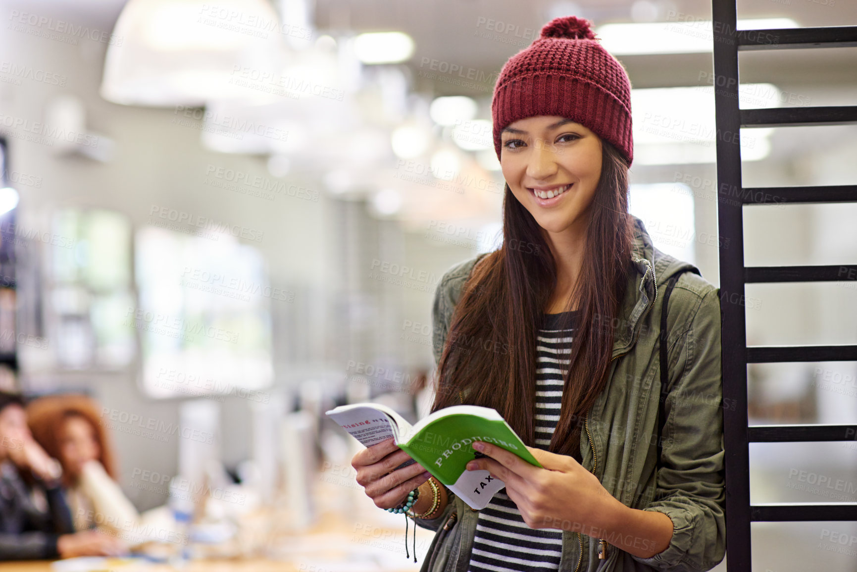 Buy stock photo Woman with smile in portrait, student in library reading book and study for exam on university campus. Education, learning and academic development with female person holding textbook for knowledge