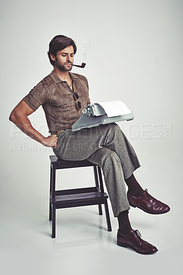 Buy stock photo Fashion, man and typewriter or pipe in studio with vintage model, hipster outfit and confidence on chair. Relax, person and reading with 70s style, calm expression and smoking with white background