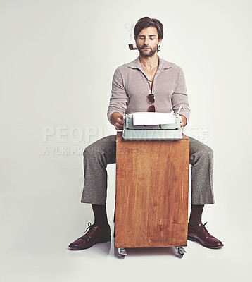 Buy stock photo Fashion, man and typewriter or smoking in studio with vintage model, hipster outfit and confidence on mockup. Relax, person and reading with 70s style, calm expression and pipe with white background