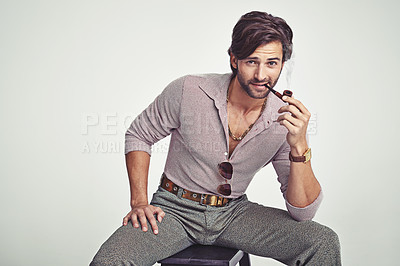 Buy stock photo Fashion, man and portrait or smoking in studio with retro pipe, hipster outfit and confidence on chair. Model, person and face with 70s style, mock up space and calm expression with white background