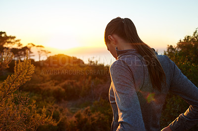 Buy stock photo Rearview shot of a young runner outdoors