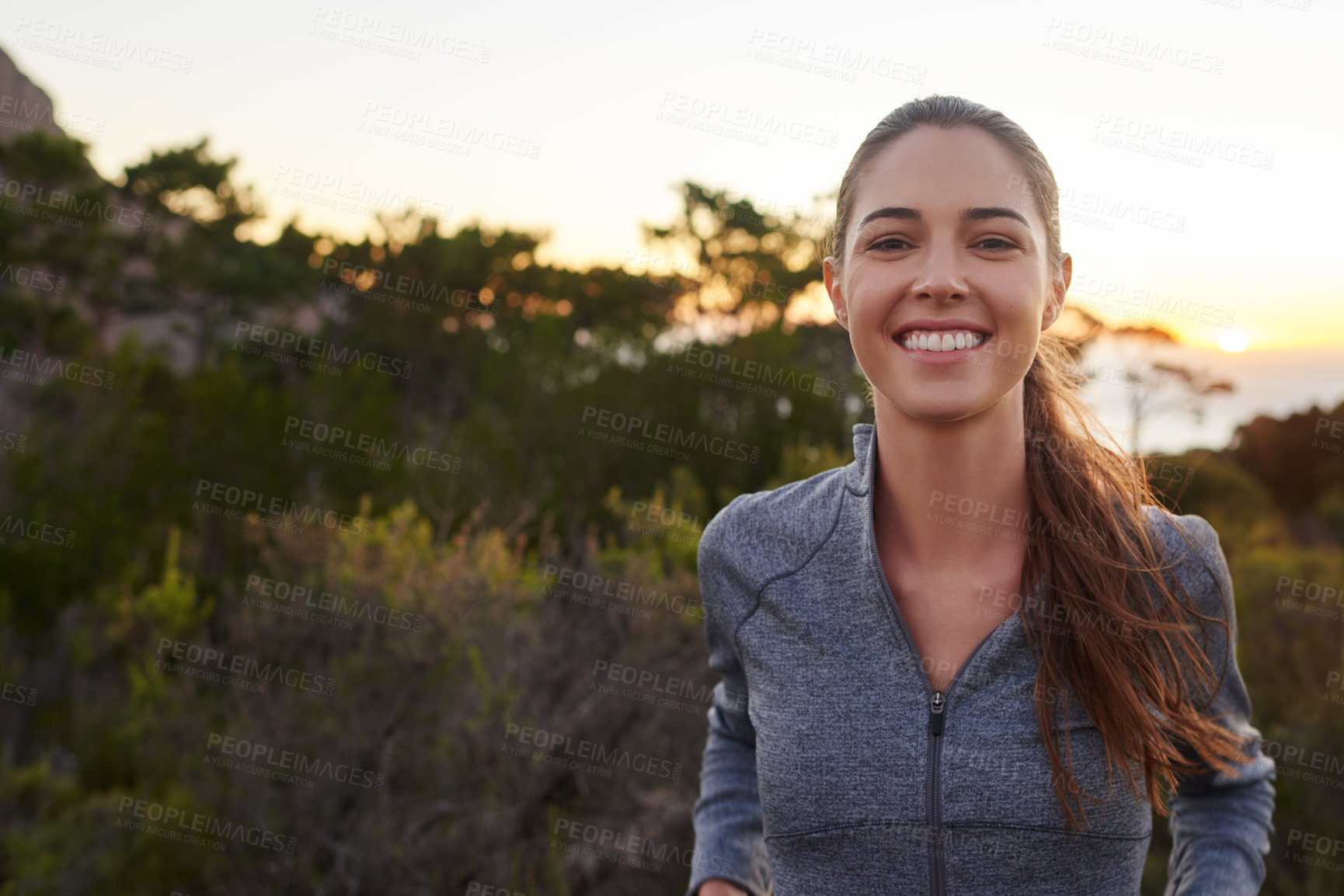 Buy stock photo Portrait of a young runner taking a break