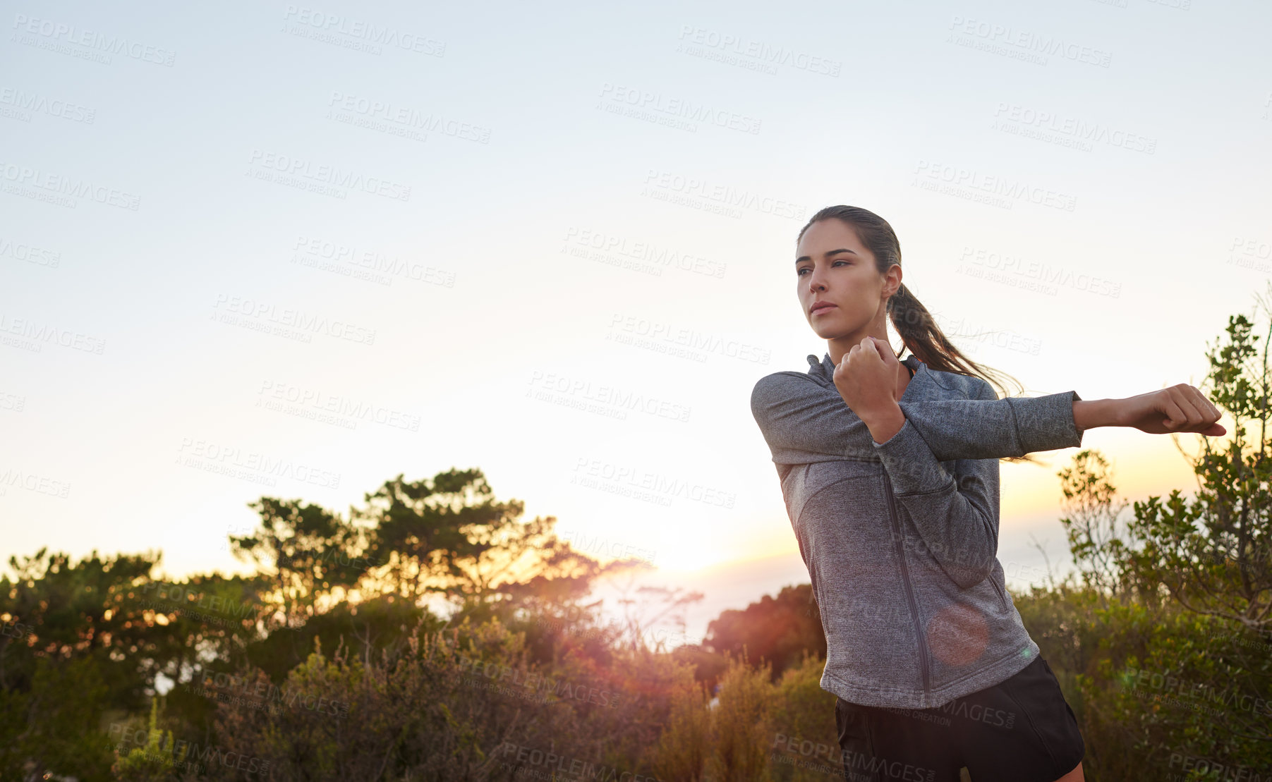 Buy stock photo Hiking, stretching and thinking with runner woman outdoor in nature for start of exercise or fitness. Cardio, health and wellness with athlete person in park for training, warm up or workout
