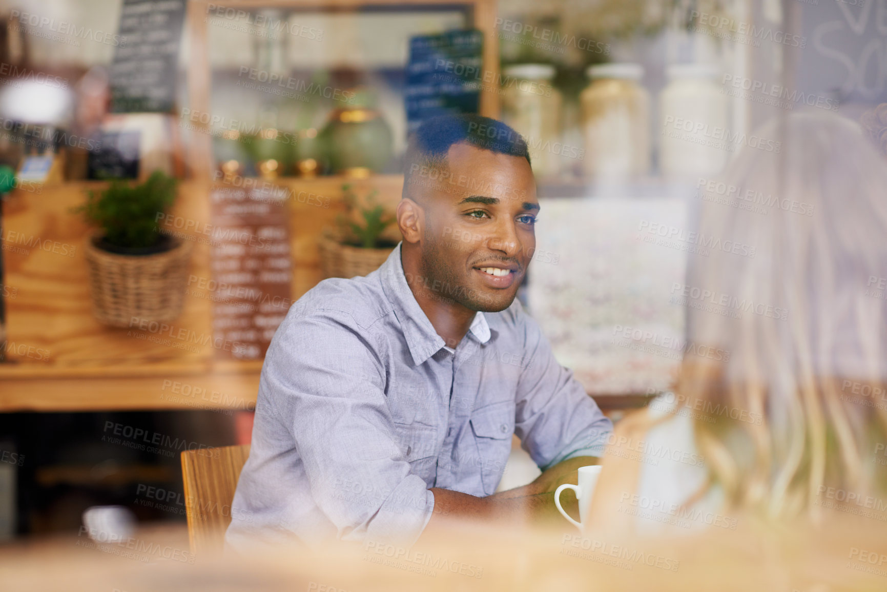 Buy stock photo Happy, man and friends in window at cafe for brunch together on holiday or vacation in Mexico. Person, smile and talk to people in coffee shop for social, conversation at lunch with espresso or latte