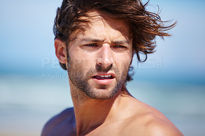 Buy stock photo Face, idea and wind with a man on the beach for freedom, travel or vacation in summer. Nature, thinking and wellness with a shirtless young person at peace on the coast for a tropical holiday