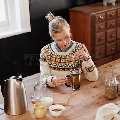 Buy stock photo Woman, happy and herbal tea for wellness in home and warm beverage of herbs mixture for health. Kitchen, lady and detox with dry leaves in plunger and chamomile drink to relax in apartment in above