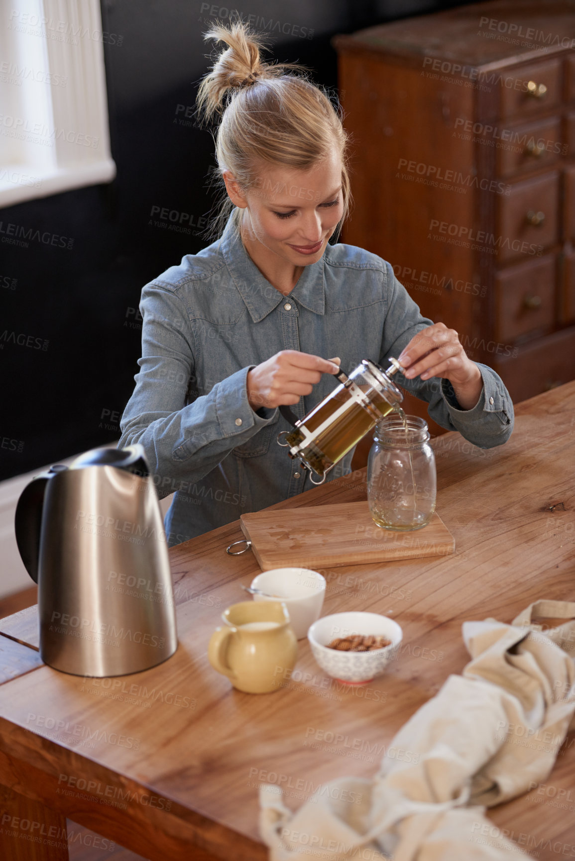 Buy stock photo Woman, happy and tea of herbs in home and warm beverage of herbal mixture for health wellness. House, homeopath and detox with dry leaves in plunger and chamomile drink to relax in kitchen by table