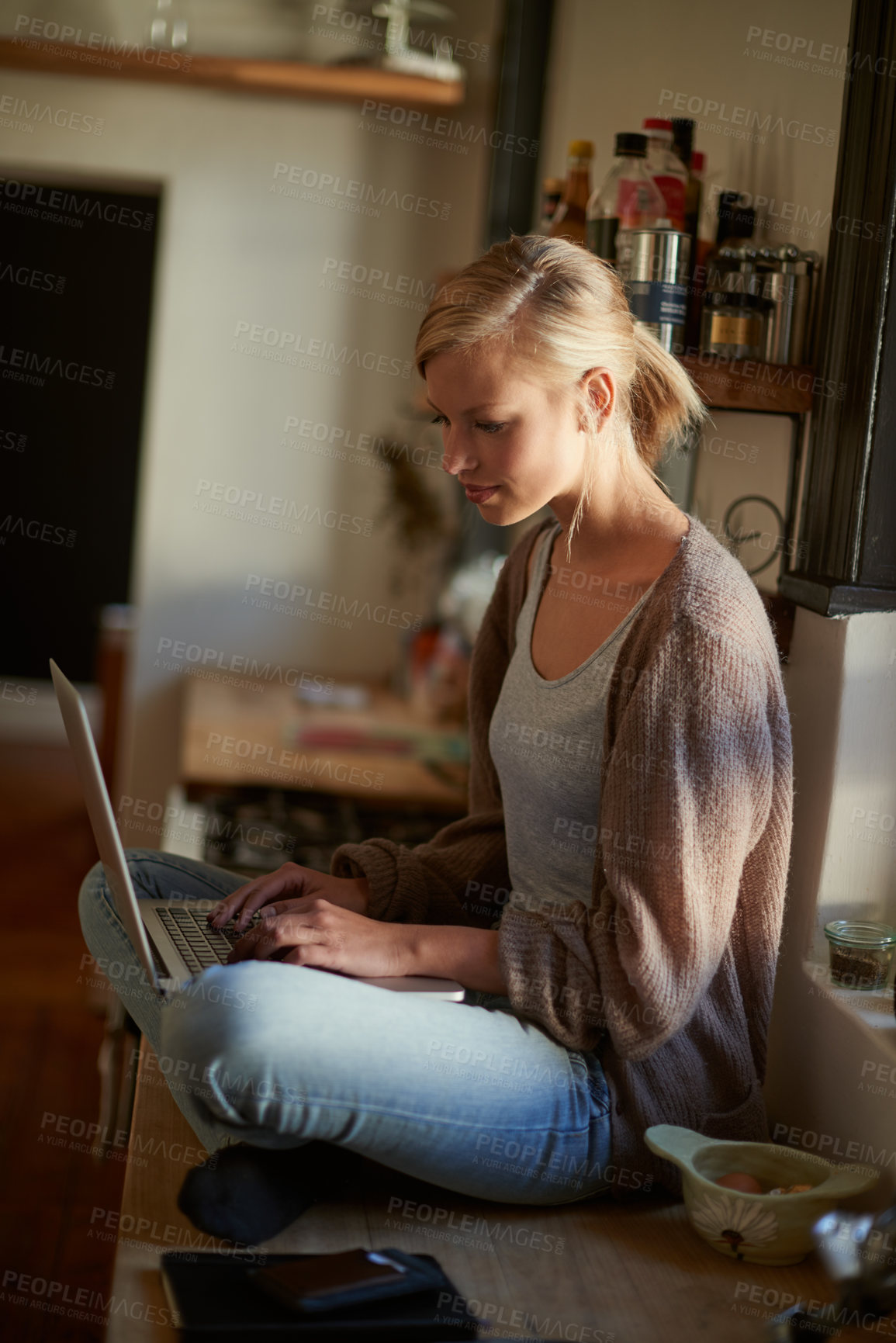 Buy stock photo Woman, kitchen and laptop with technology, counter and connection for learning, internet or email. Influencer, and research for blog, payment or registration for planning, working or remote work